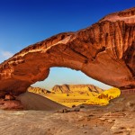 View through a rock arch in the desert of Wadi Rum