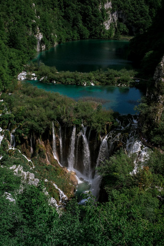 Breathtaking view of cascading waterfalls and lush landscape at Plitvice Lakes National Park.