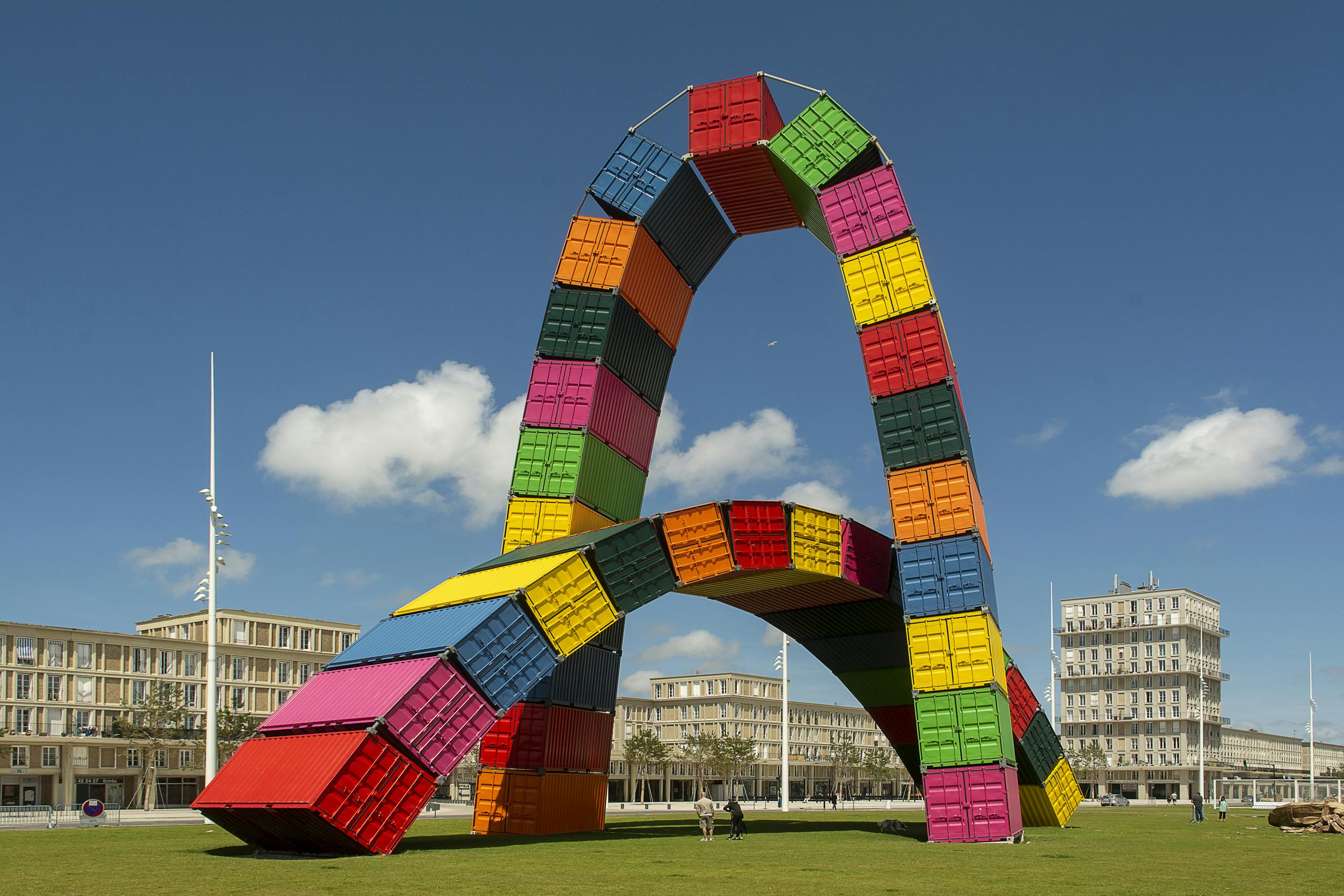 Vibrant sculpture made of shipping containers in Le Havre, France park, capturing architectural creativity.